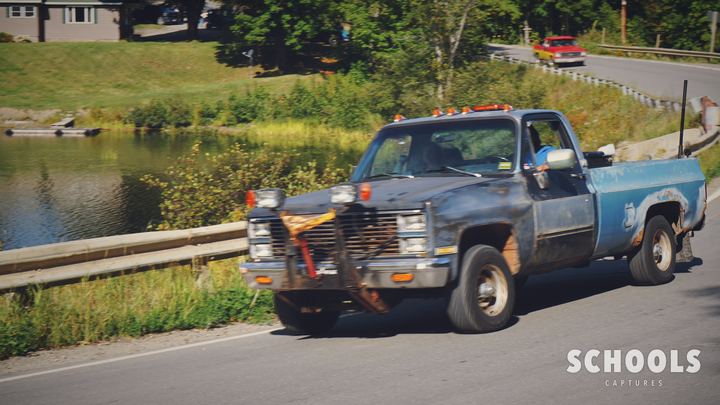 Light blue plow truck, beat up